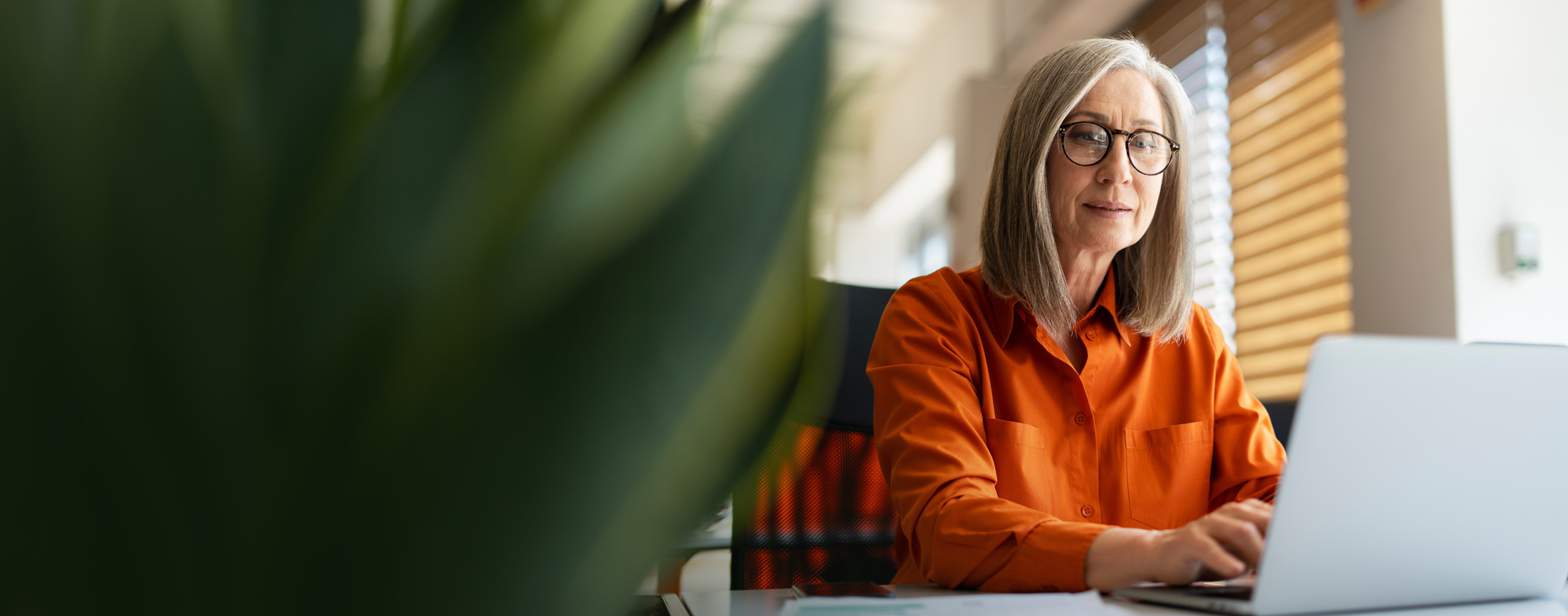 A senior professional reviewing a decision record